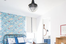 12 The kid’s bedroom is done with a nautical feel, with catchy wallpaper and rugs
