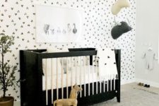 a black and white crib is perfect for modern nurseries