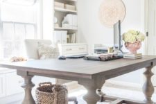 12 an oversized rustic vintage table used as a desk looks very contrasting to the modern home office