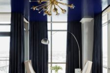 13 a shiny navy ceiling is a cool way to add a touch of color and a moody feel to the monochromatic bedroom