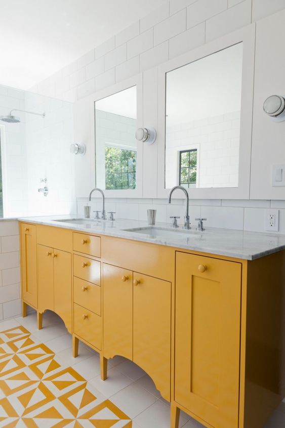 a sunny yellow vanity with cutouts is a simple yet stylish idea with a stone countertop