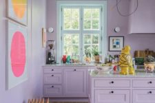 13 a tender lilac kitchen with bright abstract artworks is a very girlish and welcoming space