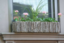 13 a wig and branch window box with greenery and pink blooms is a great idea to add a natural feel to your window