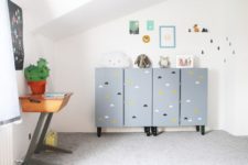 13 an IKEA Ivar cabinet customized with grey paint, cloud prints and black legs for a nursery or a kids’ room