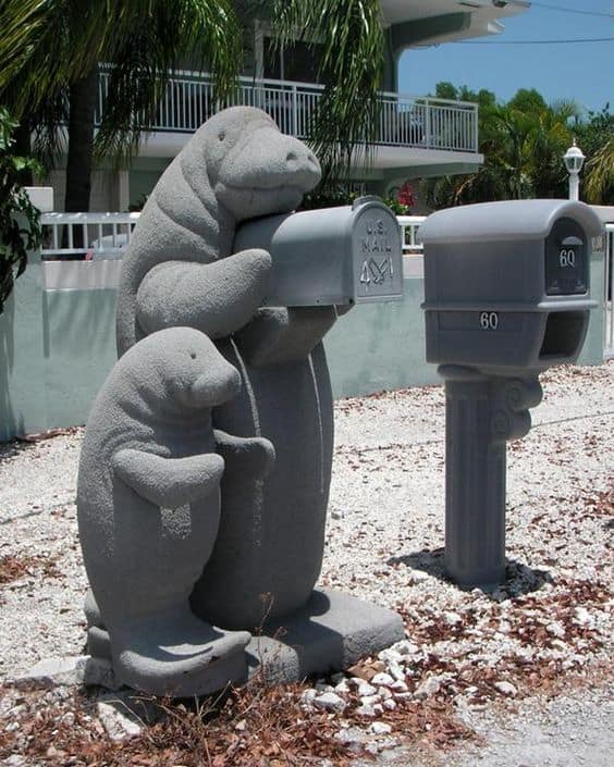 fun seal figurines holding the mailbox is a very fun and welcoming idea, your guests will never forget that