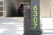 14 a grey sign with neon green numbers looks ultra-modern and bold and hints on the contemporary decor inside