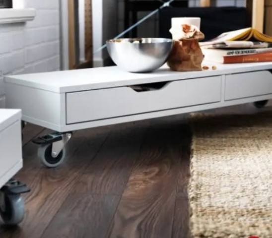 an Ekby Alex shelf on casters can become a rolling coffee table for a modern living room