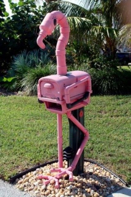an industrial pink flamingo mailbox is a gorgeous idea for a southern place, and it's a fresh take on famous bird decor