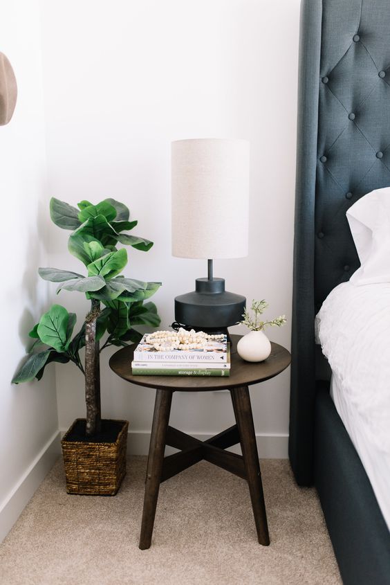 Throw away your old bedside table and place a stool instead   you don't need any special nightstands