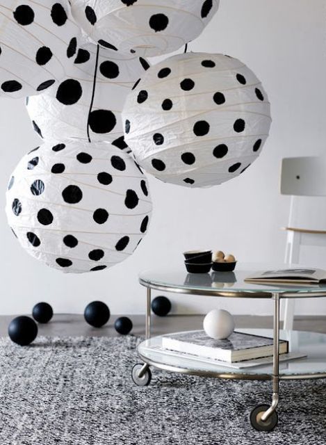 a fun cluster of lamps with black polka dots made of IKEA Regolit lampshades to add fun to your space