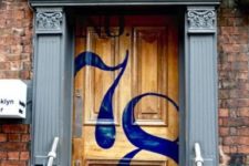 16 bright house numbers painted right on the front door is a stylish and fun idea for a modern space