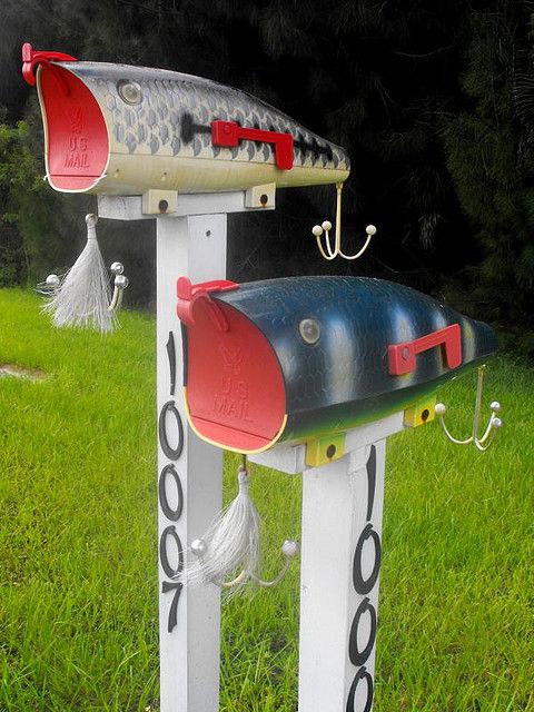 fishy mailboxes with various fishing stuff and house numbers are a fun idea for a coastal or beach home