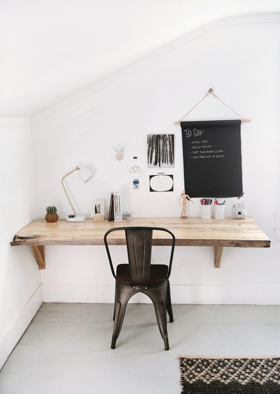 a living edge wall-mounted wooden desk is a smart idea to save some space