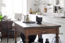 17 a vintage rustic kitchen island with much storage in a neutral and modern kitchen