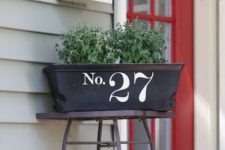 17 stencil or apply vinyl numbers to a planter box next to the front door, this is a quick DIY project with a cool look