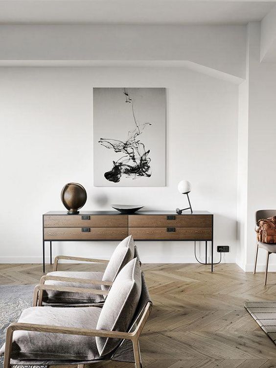the floor, chairs and a sideboard of complementary wood tones are great for an edgy feel