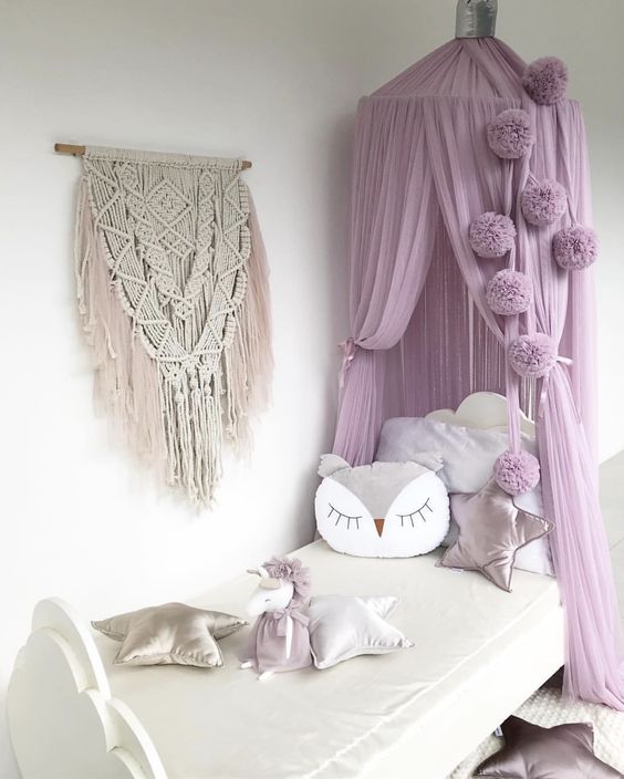 a girl's bedroom with a dreamy lilac canopy over it raises it to a new level