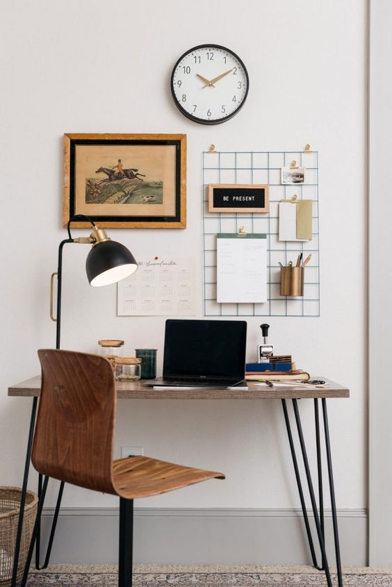 a super sleek desk with hairpin legs and a matching rotating chair are a nice setup for a manly space