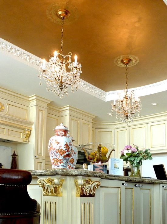 accentuate your kitchen with a chic ceiling decorated with gold leaf and with exquisite chandeliers