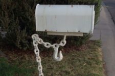 20 a mailbox being help up by a chain looks as if it’s really hanging in the air, so bold and cool
