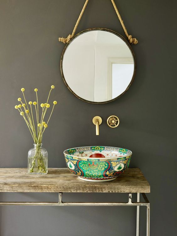 a unique sink of a painted porcelain bowl is a cool idea to add color and pattern to the bathroom