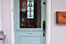 21 a colorful paint stick sign with house numbers hanging on the front door – a cool idea instead of a wreath on the front door