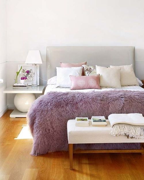 a lilac fur throw is a chic accessory for a bedroom, it brings color to the space and can be easily changed