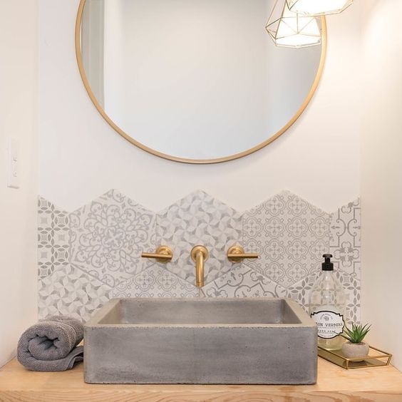 a square concrete sink is a statement idea for such a glam space, it complements its perfectly with its rough texture