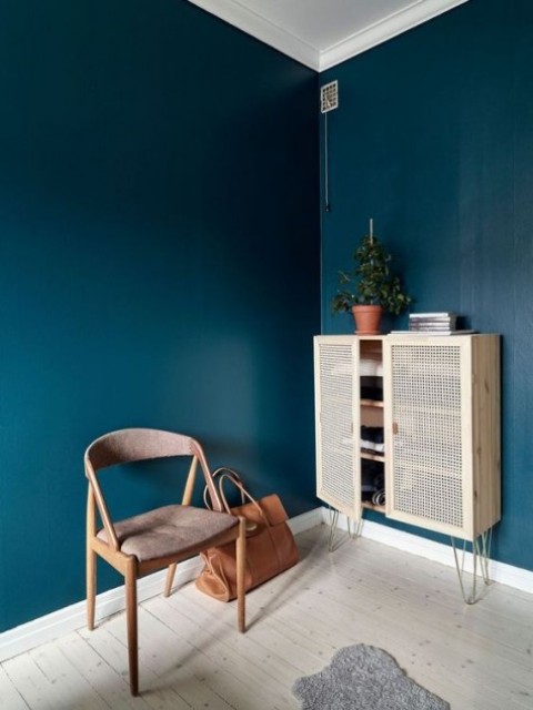 an IKEA Ivar cabinet spruced up with hairpin legs and cane doors is a stunning storage piece with an edge