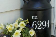 22 a large black milk churn with white house numbers on your porch is a nice idea to show your address with a rustic feel