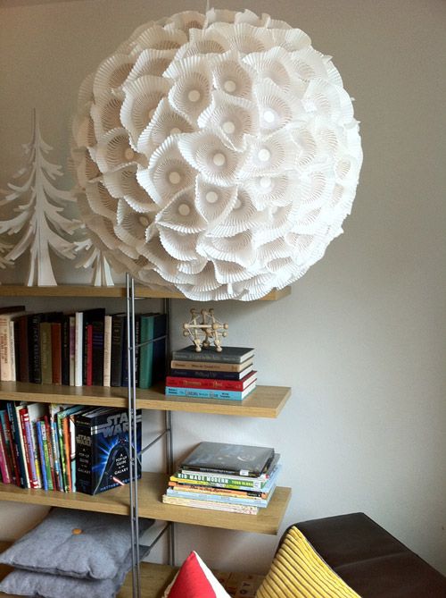 a sculptural paper orb light made of an IKEA Regolit lampshade and some cupcake lines