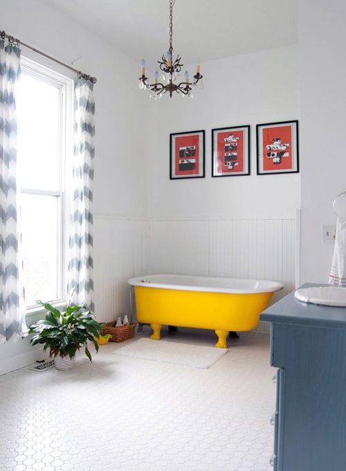 A cozy neutral space with a bold yellow bathtub   you may paint on yourself