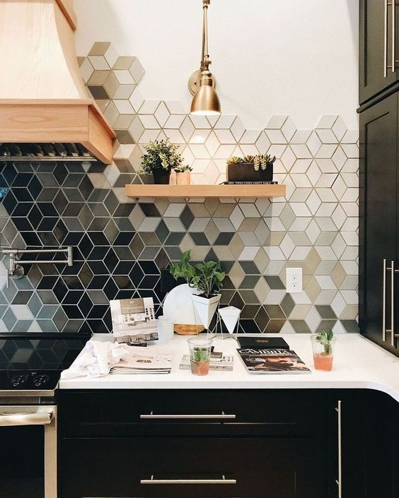a geometric ombre kitchen tile backsplash makes a monochromatic kitchen bold