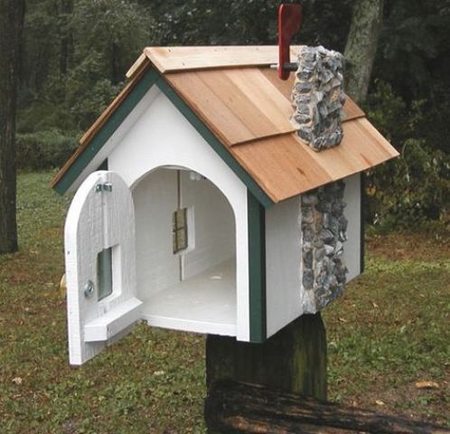 a whimsy mailbox looking like an actual house with even a stone pipe is a fun idea