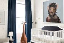23 a whimsy modern nursery decorated with a leather ottoman, a large toy giraffe, an artwork and rugs