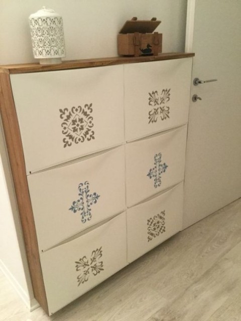 an IKEA Trones shoe cabinet spruced up with colorful stickers and with a wooden waterfall countertop for an entryway