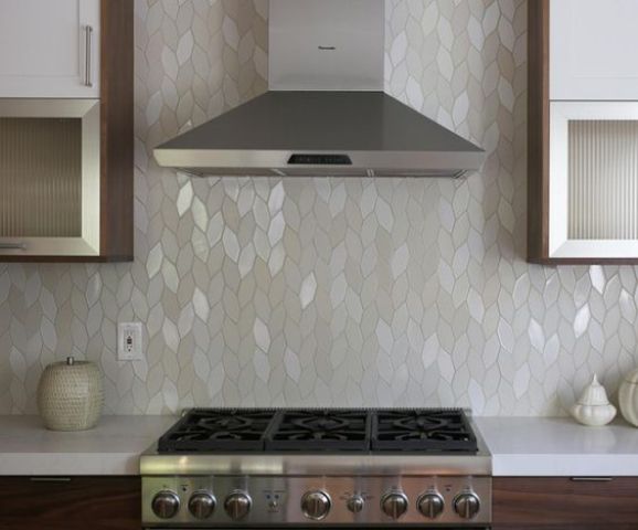 a beautiful mother of pearl kitchen backsplash is a unique idea to go for