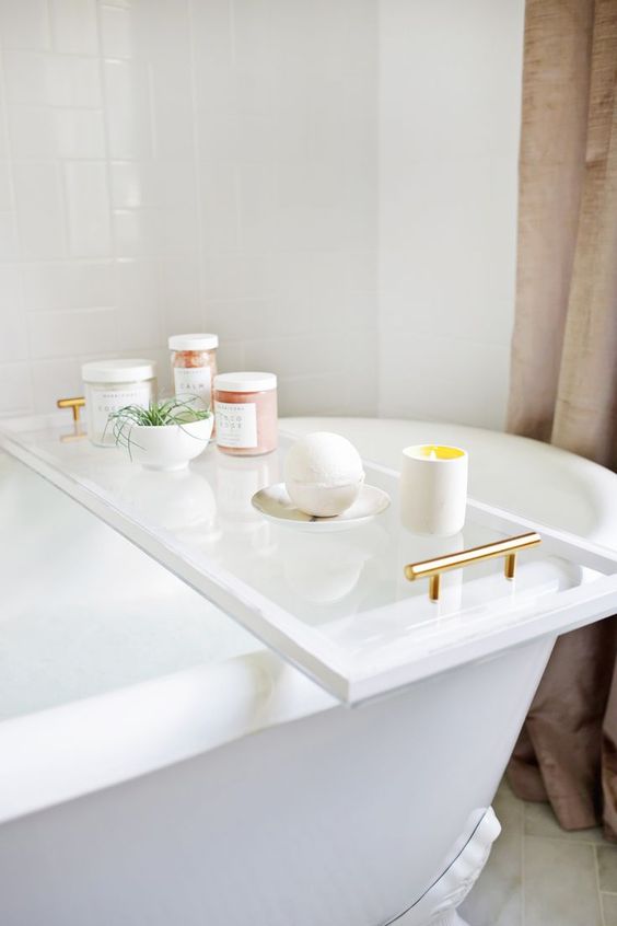 a chic bathroom caddy of lucite will bring a fresh look to your bathroom