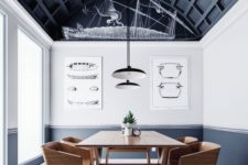 25 an arched ceiling done with black paneling takes over the whole space and makes a statement