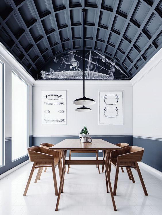 An arched ceiling done with black paneling takes over the whole space and makes a statement