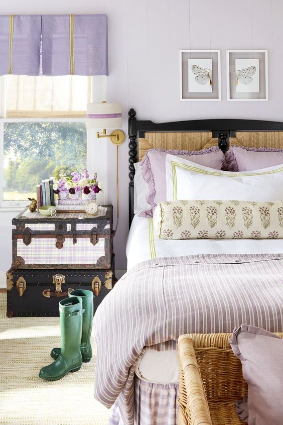lilac curtains, pillows and a blanket are simple and cute accessories for a woman's bedroom