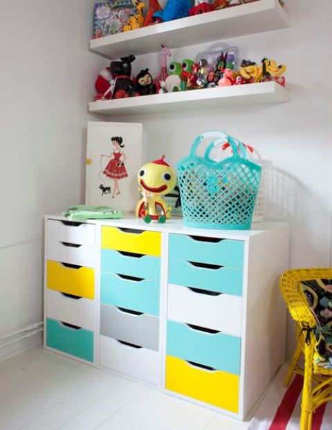 a bold storage unit for a kids' space made of three Alex drawer pieces renovated with turquoise and yellow contact paper