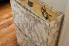30 spruce up your IKEA Trones piece with marble and wood grain contact paper to give it a cool and chic look