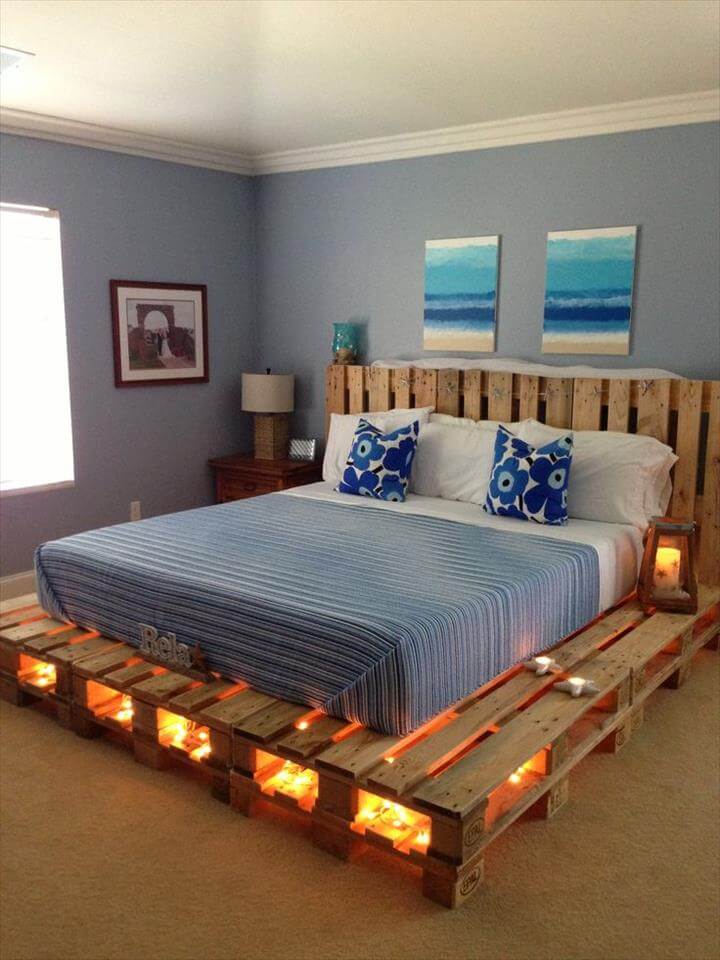 a comfy pallet bed with lights inside allows you to skip lamps on your nightstands and creates a romantic ambience