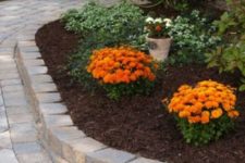 04 elegant outdoor bricks covering the pathway and the flower bed for a cohesive and more formal look