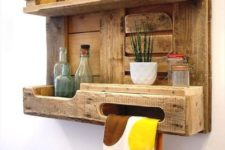 06 a rustic pallet kitchen shelf with a lantern, jars and bottles and even a towel holder is a cool piece