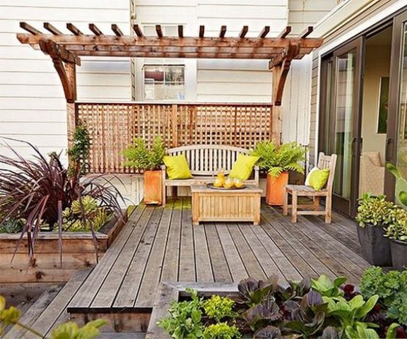 a bright summer deck decorated with orange and neon green touches for a bright ambience