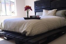 07 a dark painted pallet bed looks unusual and more harsh than a usual light stained one