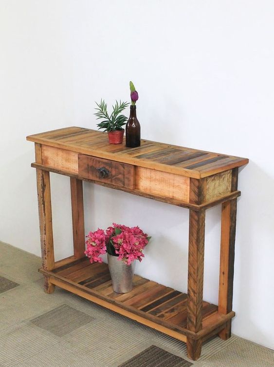 a rustic pallet console with a slatted top and shelf plus a small drawer for a small entryway