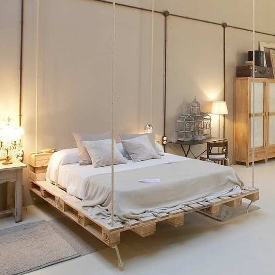 a hanging pallet bed is a creative and chic idea, it's very dreamy and less bulky-looking
